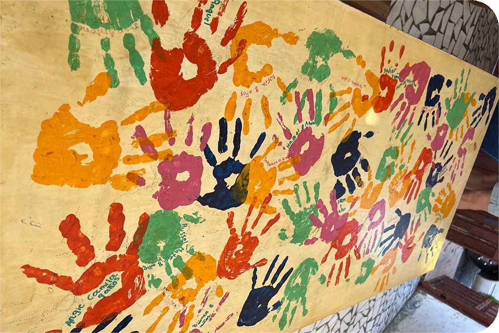 Hand prints on a wall.